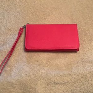 NWOT pink vinyl cellphone wallet. Never used.